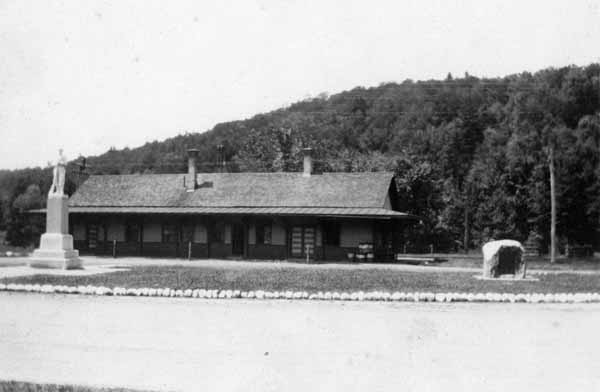 Railroad Station, Warren, New Hampshire, showing a bit of the Park, Soldier's Monument and Honor Roll