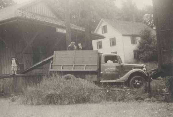 Noyes truck and crew unloading coal into Berlin station